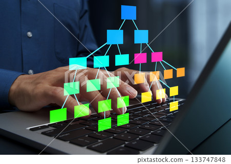 Data structures and tree diagrams.Programmer using laptop for software development. 133747848