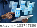 Business reports. Texts with graphs and charts. Document management systems. Tablet computers. 133747860