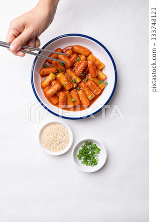 Korean Tteokbokki (simmered rice cake) and sausage with spicy sauce Korean Tteokbokki (simmered rice cake) and sausage with spicy sauce 133748121