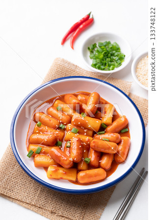 Korean Tteokbokki (simmered rice cake) and sausage with spicy sauce Korean Tteokbokki (simmered rice cake) and sausage with spicy sauce 133748122