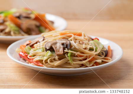 Vegetarian stir fried noodles with mushroom and vegetables with soy sauce, Asian food style Vegetarian stir fried noodles with mushroom and vegetables with soy sauce, Asian food style 133748152