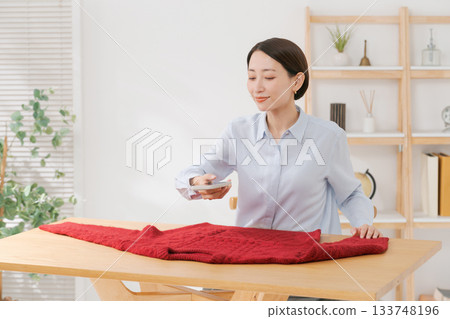 A woman trying to sell unwanted items 133748196