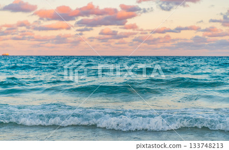 Dramatic sunrise horizon at sea. Romantic summer vacation on sunset seascape. Sea sunset on ocean. Sunset seascape at summer vacation. Sunrise with sea beach Dramatic sunrise horizon at sea. Romantic summer vacation on sunset seascape. Sea sunset on ocean. Sunset seascape at summer vacation. Sunrise with sea beach 133748213