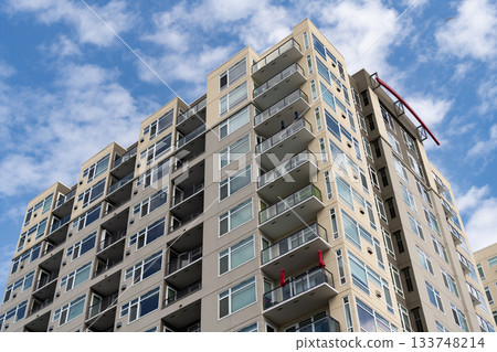 Modern condominium building. Architectural building in residential area. Building perspective view. Condominium architecture. Architecture building. Residential condominium Modern condominium building. Architectural building in residential area. Building perspective view. Condominium architecture. Architecture building. Residential condominium 133748214