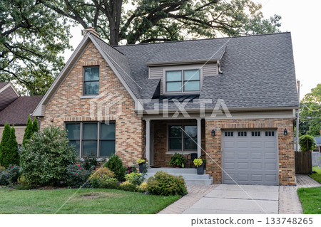 Suburban neighborhood. Private family home architecture. House exterior. Private house in suburban area. Suburban house architecture. Suburb exterior with private housing. Private driveway Suburban neighborhood. Private family home architecture. House exterior. Private house in suburban area. Suburban house architecture. Suburb exterior with private housing. Private driveway 133748265