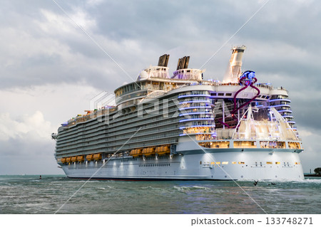 Travel at sea. Vacation on cruise ship liner. Luxury liner. Ship leaving port. Sea trip. Traveling and voyage. Cruise ship vacation. View on cruise ship in vacation summer. Cruise voyage 133748271