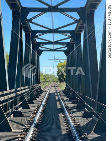 Steel train bridge in a rural area, Ferrara, Italy 133748608