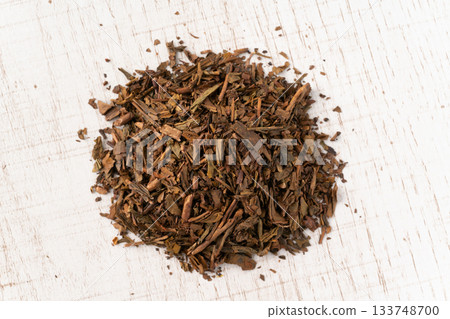 Hojicha tea leaves placed on a white plate Hojicha tea leaves placed on a white plate 133748700