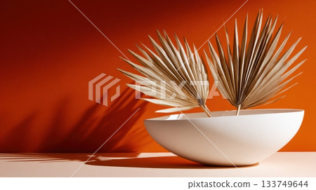 Unique dried leaves arrangement in a white bowl 133749644