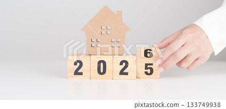 2025 end year to Happy New Year 2026 with house model. real estate, Home loan and mortgage, tax, investment, financial, savings and New Year Resolution concepts 2025 end year to Happy New Year 2026 with house model. real estate, Home loan and mortgage, tax, investment, financial, savings and New Year Resolution concepts 133749938