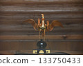 Details of the shrine's golden decorations and traditional sacred implements with a phoenix motif 133750433