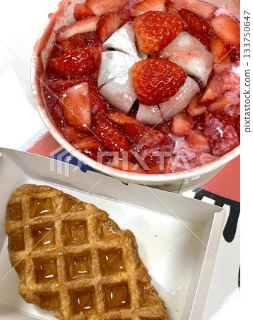Soft and fluffy strawberry bingsu with finely shaved ice, sweet strawberry syrup, and fresh strawberry slices. A refreshing and delightful Korean dessert, perfect for a cool and fruity treat. Soft and fluffy strawberry bingsu with finely shaved ice, sweet strawberry syrup, and fresh strawberry slices. A refreshing and delightful Korean dessert, perfect for a cool and fruity treat. 133750647