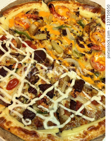 A delicious pizza with a golden crust, melted cheese, and savory toppings. Perfect for food-related designs, menus, or Italian-themed projects, capturing the essence of a classic comfort dish. A delicious pizza with a golden crust, melted cheese, and savory toppings. Perfect for food-related designs, menus, or Italian-themed projects, capturing the essence of a classic comfort dish. 133750650