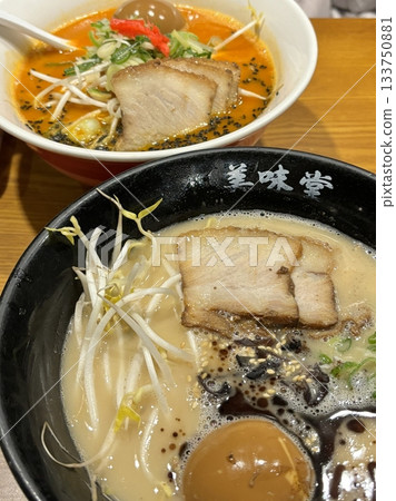 A steaming bowl of ramen with rich broth, tender noodles, sliced pork, boiled egg, nori, and fresh green onions. A comforting and flavorful Japanese classic. A steaming bowl of ramen with rich broth, tender noodles, sliced pork, boiled egg, nori, and fresh green onions. A comforting and flavorful Japanese classic. 133750881