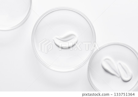 A sample of cosmetic moisturizing or anti-aging cream in a petri dish. 133751364