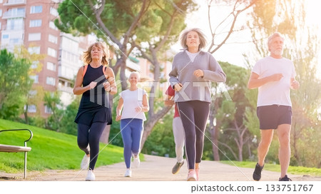 Seniors with gray hair jogging outdoors in the park Seniors with gray hair jogging outdoors in the park 133751767