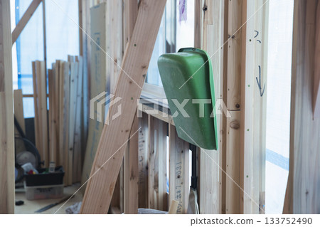 Dustpan hanging at a construction site Dustpan hanging at a construction site 133752490