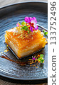 Delicate gourmet Eid dessert featuring vibrant colors and luxurious textures on a beautifully crafted plate 133752496