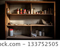A hauntingly still pantry, bathed in soft sunlight, captures the essence of abandonment. Dust-covered cans and containers reflect moments frozen in time, telling tales of a once-bustling . 133752505