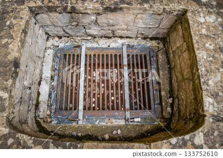 Rusted Wishes tells the story of hope preserved through time. Each coin beneath the iron grate becomes a relic of faith weathered by age. Rusted Wishes tells the story of hope preserved through time. Each coin beneath the iron grate becomes a relic of faith weathered by age. 133752610