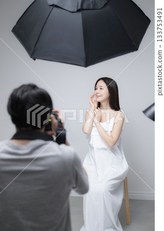 Studio photography of female model and photographer, portrait of beauty image Studio photography of female model and photographer, portrait of beauty image 133753491