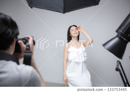 Studio photography of female model and photographer, portrait of beauty image Studio photography of female model and photographer, portrait of beauty image 133753495