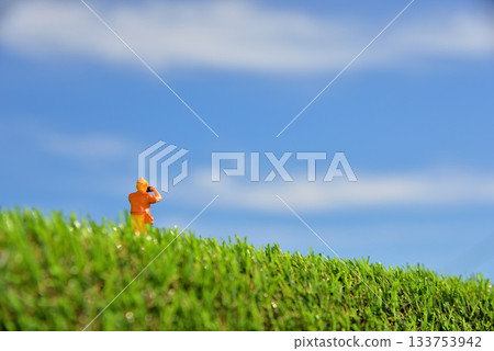 Image of a woman taking a photo with a camera 133753942