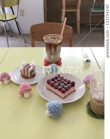 Light and creamy desserts with delicate layers, fresh fruits, and rich flavors, paired with refreshing sweet drinks. A perfect café treat for a delightful and indulgent experience. 133754140