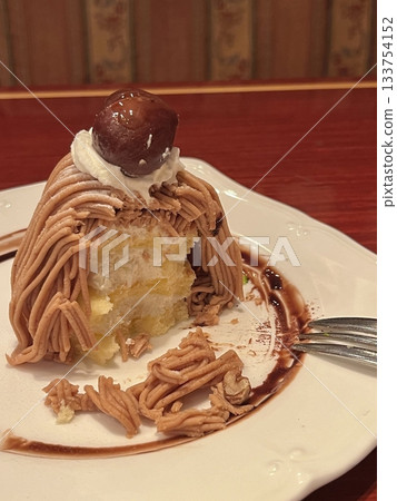 Delicate and creamy Mont Blanc dessert with a rich chestnut purée, airy whipped cream, and a buttery base. A perfect balance of nutty sweetness and velvety texture for an elegant treat. Delicate and creamy Mont Blanc dessert with a rich chestnut purée, airy whipped cream, and a buttery base. A perfect balance of nutty sweetness and velvety texture for an elegant treat. 133754152