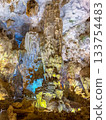 The magnificent limestone caverns of Thien Cung Cave illuminated by light (Halong Bay, Vietnam) 133754483