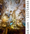 The magnificent limestone caverns of Thien Cung Cave illuminated by light (Halong Bay, Vietnam) 133754484