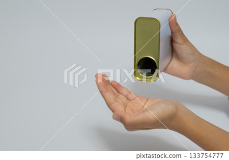 Hand putting out powder on white background with copy space Hand putting out powder on white background with copy space 133754777