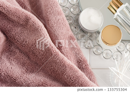 Morning skin care image with cosmetics, towel and mirror 133755304