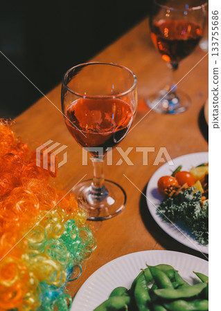 Joyful office Halloween party with coworkers in costumes, celebrating with drinks and laughter, fostering teamwork and festive spirit 133755686