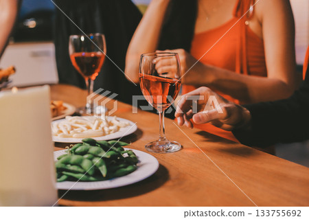 Joyful office Halloween party with coworkers in costumes, celebrating with drinks and laughter, fostering teamwork and festive spirit 133755692