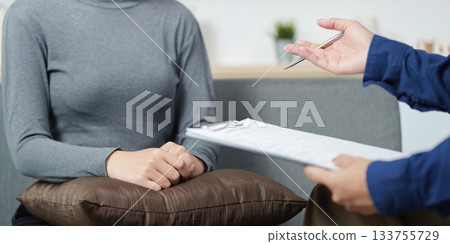 Mental Health Support. Therapist assisting a client in emotional distress during a counseling session. 133755729