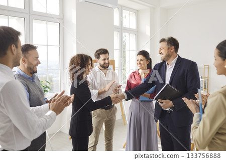Colleagues Shaking Hands During Office Meeting Celebrating Partnership Colleagues Shaking Hands During Office Meeting Celebrating Partnership 133756888