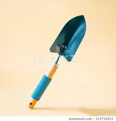 Gardening shovel on color background.Garden tool. Gardening shovel on color background.Garden tool. 133756952