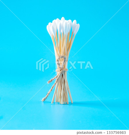A swab clean health care top view,cotton bud on blue background. A swab clean health care top view,cotton bud on blue background. 133756983