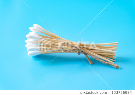 A swab clean health care top view,cotton bud on blue background. A swab clean health care top view,cotton bud on blue background. 133756984