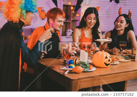 Joyful office Halloween party with coworkers in costumes, celebrating with drinks and laughter, fostering teamwork and festive spirit Joyful office Halloween party with coworkers in costumes, celebrating with drinks and laughter, fostering teamwork and festive spirit 133757182