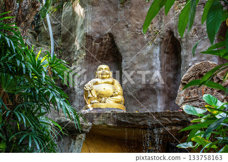Laughing Buddha by Waterfall Shrine 133758163