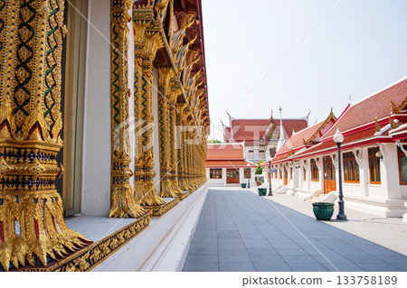 Thai temple walkway with ornate golden window columns at Wat Chana Songkhram, Bangkok 133758189