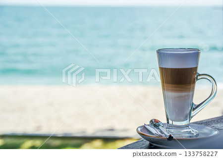 Layered Latte in Glass Cup by the Beach Layered Latte in Glass Cup by the Beach 133758227