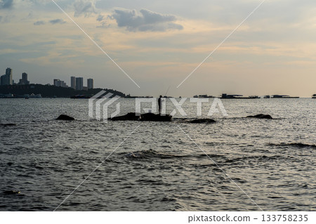 Fisherman on Coastal Rocks at Pattaya Fisherman on Coastal Rocks at Pattaya 133758235
