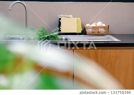 Interior of modern kitchen with sink 133758394