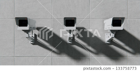 Three security cameras, surveillance mounted on wall, total control background Three security cameras, surveillance mounted on wall, total control background 133758773