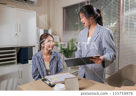 Young business women work from home office, team colleagues discuss project online, people collaborate efficiently, sharing idea and reviewing documents, positive communication fostering partnership. Young business women work from home office, team colleagues discuss project online, people collaborate efficiently, sharing idea and reviewing documents, positive communication fostering partnership. 133759976