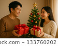 Christmas gift and smiling couple 0158 133760202