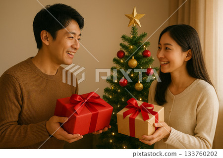 Christmas gift and smiling couple 0158 133760202